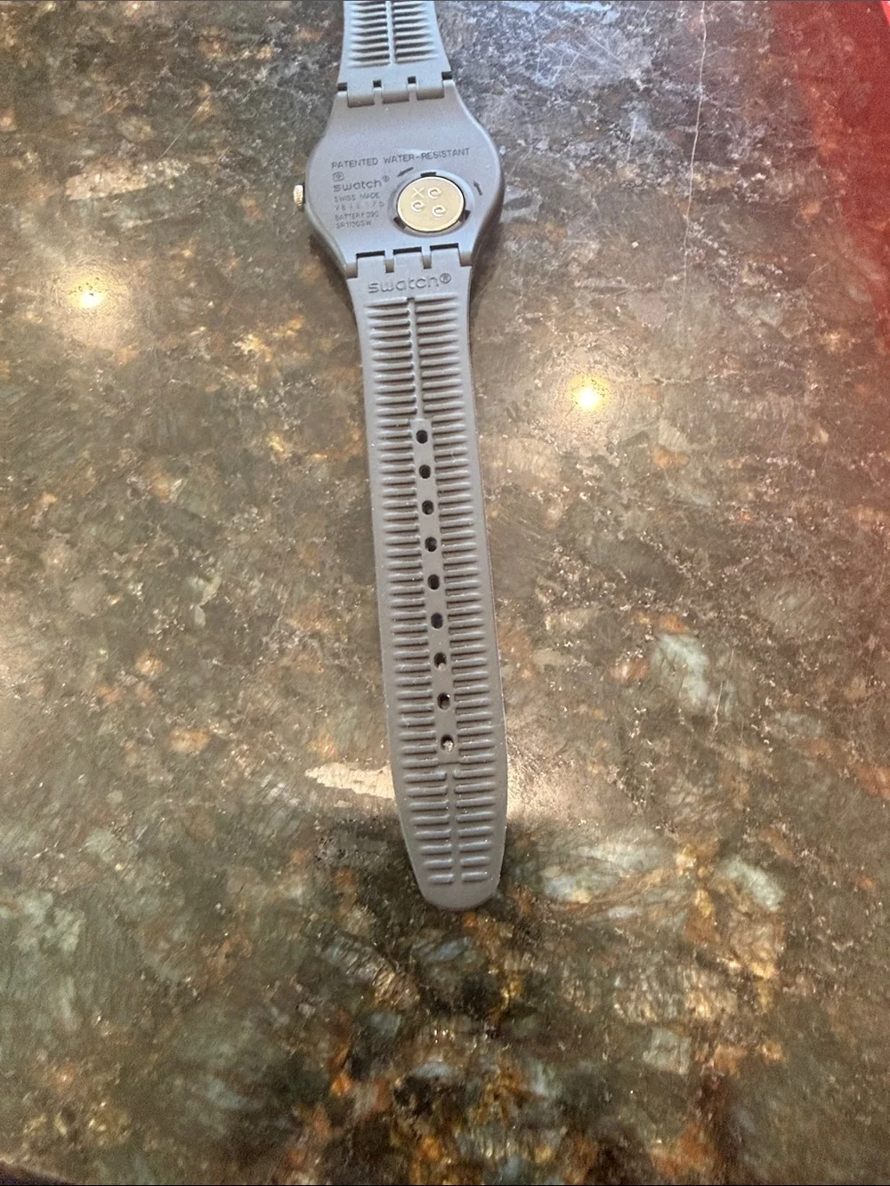 Swatch Black Silicone Strap Watch with Blackish/Grey dial.